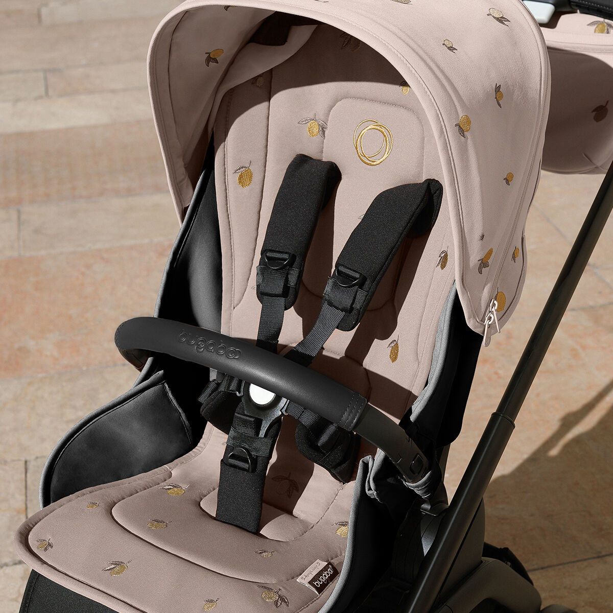 A Bugaboo stroller with Bugaboo X Konges Sløjd Limited Edition seat liner, featuring Konges Sløjd's signature lemon print.