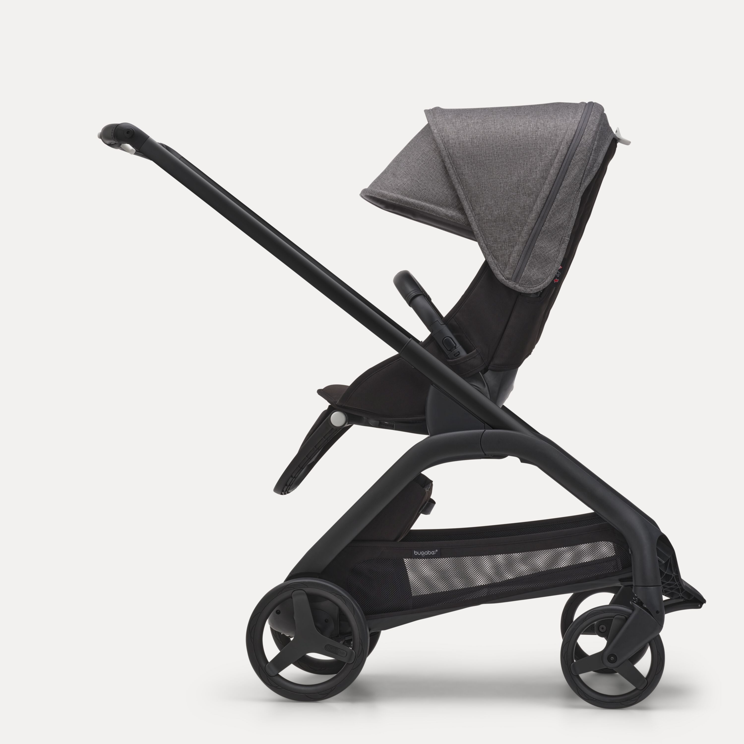 Side view of the Bugaboo Dragonfly seat stroller with black chassis, midnight black fabrics and grey melange sun canopy. - Main Modal Image Slide 2 of 16