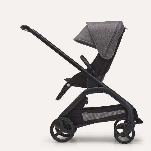Side view of the Bugaboo Dragonfly seat stroller with black chassis, midnight black fabrics and grey melange sun canopy. - Main Image Slide 2 of 16