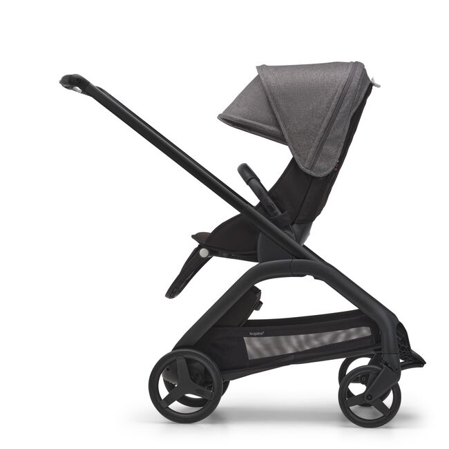 Side view of the Bugaboo Dragonfly seat stroller with black chassis, midnight black fabrics and grey melange sun canopy.