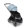 Bugaboo Dragonfly seat stroller with graphite chassis, midnight black fabrics and skyline blue sun canopy. The sun canopy is fully extended.