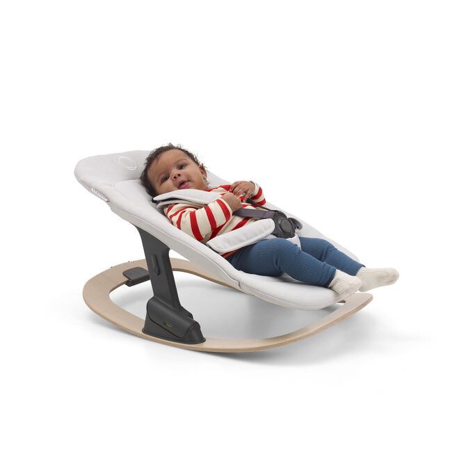 Baby in a Bugaboo Giraffe rocker (comprised of the rocker frame and newborn set). - Main Image Slide 6 of 7