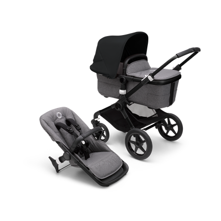 Bugaboo Fox 3 carrycot and seat pushchair with black frame, grey fabrics, and black sun canopy. - view 1