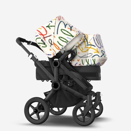 Bugaboo Donkey 5 Duo bassinet and seat stroller black base, midnight black fabrics, art of discovery white sun canopy