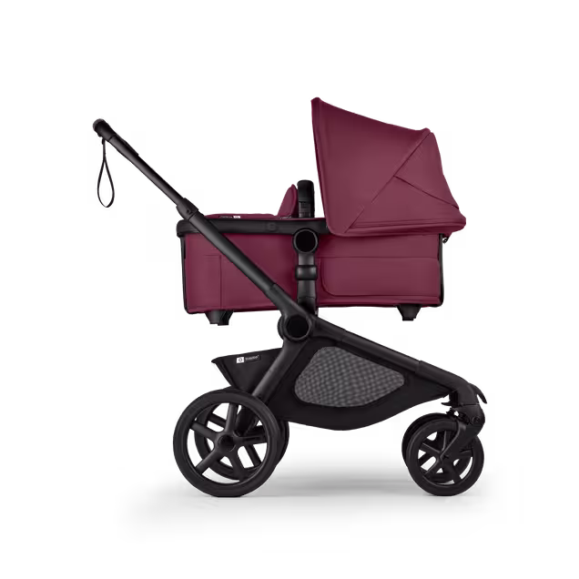 Side view of Bugaboo Kangaroo 2-in-1 stroller with one bassinet, Dark Cherry fabrics, and Dark Cherry sun canopy. - Main Image Slide 2 of 18