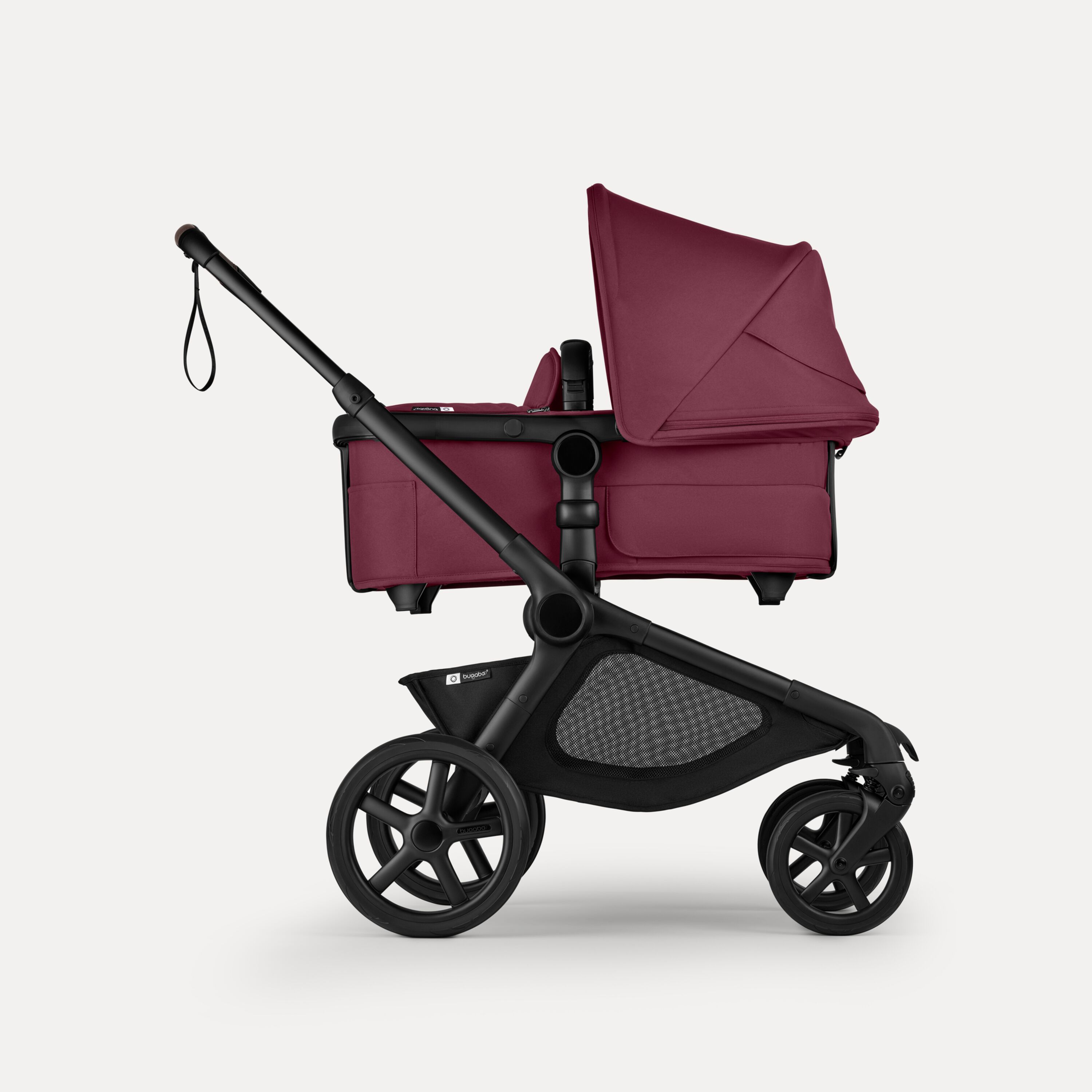Side view of Bugaboo Kangaroo 2-in-1 stroller with one bassinet, Dark Cherry fabrics, and Dark Cherry sun canopy. - Main Modal Image Slide 2 of 18