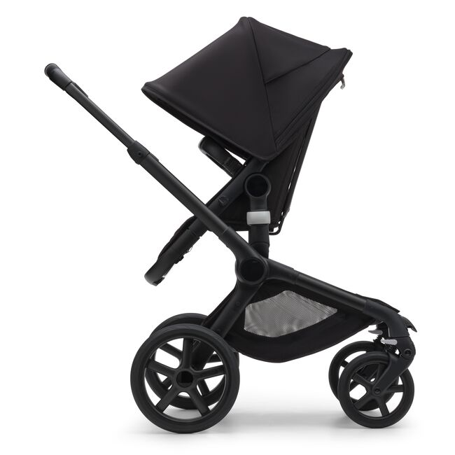 Side view of the Bugaboo Fox 5 seat pushchair with black chassis, midnight black fabrics and midnight black sun canopy.