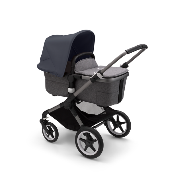 Bugaboo Fox 3 bassinet stroller with graphite frame, grey fabrics, and stormy blue sun canopy.