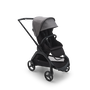 Bugaboo Dragonfly seat stroller with black chassis, midnight black fabrics and grey melange sun canopy.