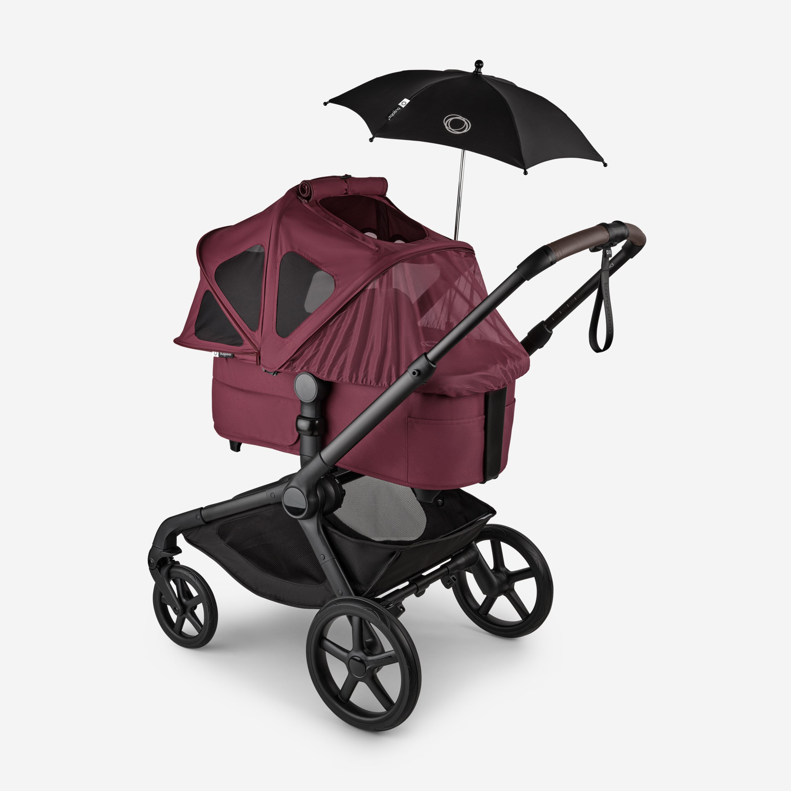 Bugaboo Kangaroo 2-in-1 stroller with a bassinet and a breezy sun canopy in Dark Cherry fabrics and a black parasol. The sun canopy is fully extended with the mosquito net covering the bassinet. - Main Modal Image Slide 17 of 18