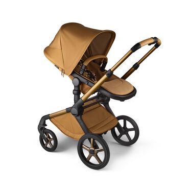 A Bugaboo Fox 5 Noir Limited Edition seat pushchair in Amber Glow colourway. - view 2