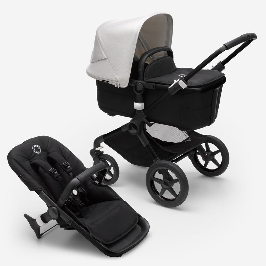 Bugaboo Fox 3 bassinet and seat stroller with black frame, black fabrics, and white sun canopy.