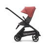 Side view of the Bugaboo Dragonfly seat stroller with black chassis, grey melange fabrics and sunrise red sun canopy. - Thumbnail Slide 3 of 18