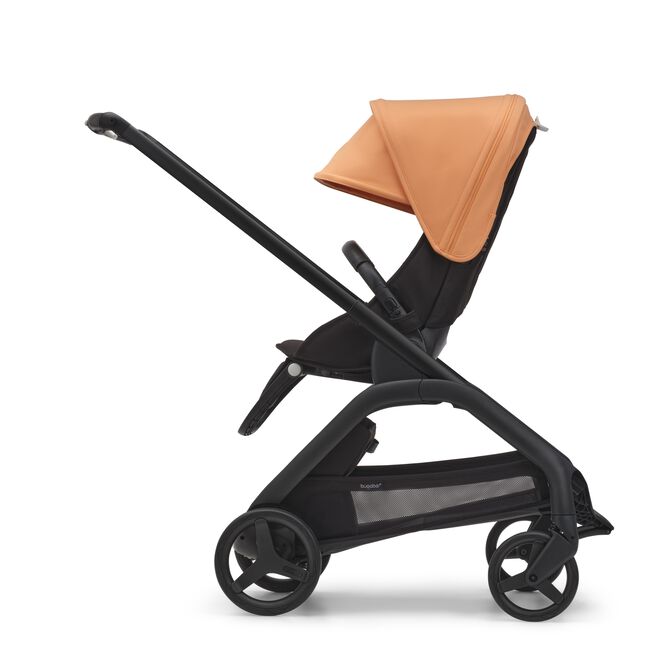 Side view of the Bugaboo Dragonfly seat stroller with black chassis, midnight black fabrics and island coral sun canopy.