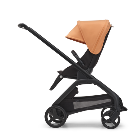 Side view of the Bugaboo Dragonfly seat stroller with black chassis, midnight black fabrics and island coral sun canopy. - view 2