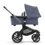 Side view of the Bugaboo Fox 5 bassinet stroller with graphite chassis, stormy blue fabrics and stormy blue sun canopy. - Thumbnail Slide 3 of 16