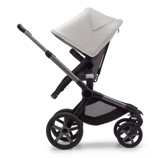 Side view of the Bugaboo Fox 5 seat pushchair with graphite chassis, grey melange fabrics and misty white sun canopy. - Main Image Slide 3 of 13
