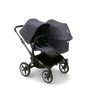 Bugaboo Donkey 5 Duo seat and bassinet stroller with graphite chassis, stormy blue fabrics and stormy blue sun canopy. - Thumbnail Slide 1 of 12
