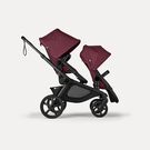 Bugaboo Kangaroo 2-in-1 tandem stroller with two seats, with Dark Cherry fabrics and Dark Cherry sun canopies.