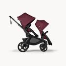 Bugaboo Kangaroo 2-in-1 tandem stroller with two seats, with Dark Cherry fabrics and Dark Cherry sun canopies.
