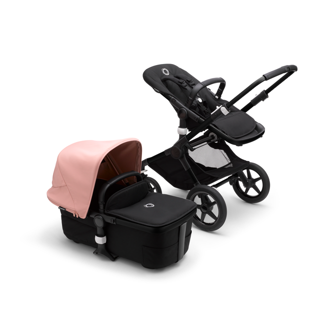 Bugaboo Fox 3 bassinet and seat stroller with black frame, black fabrics, and pink sun canopy.