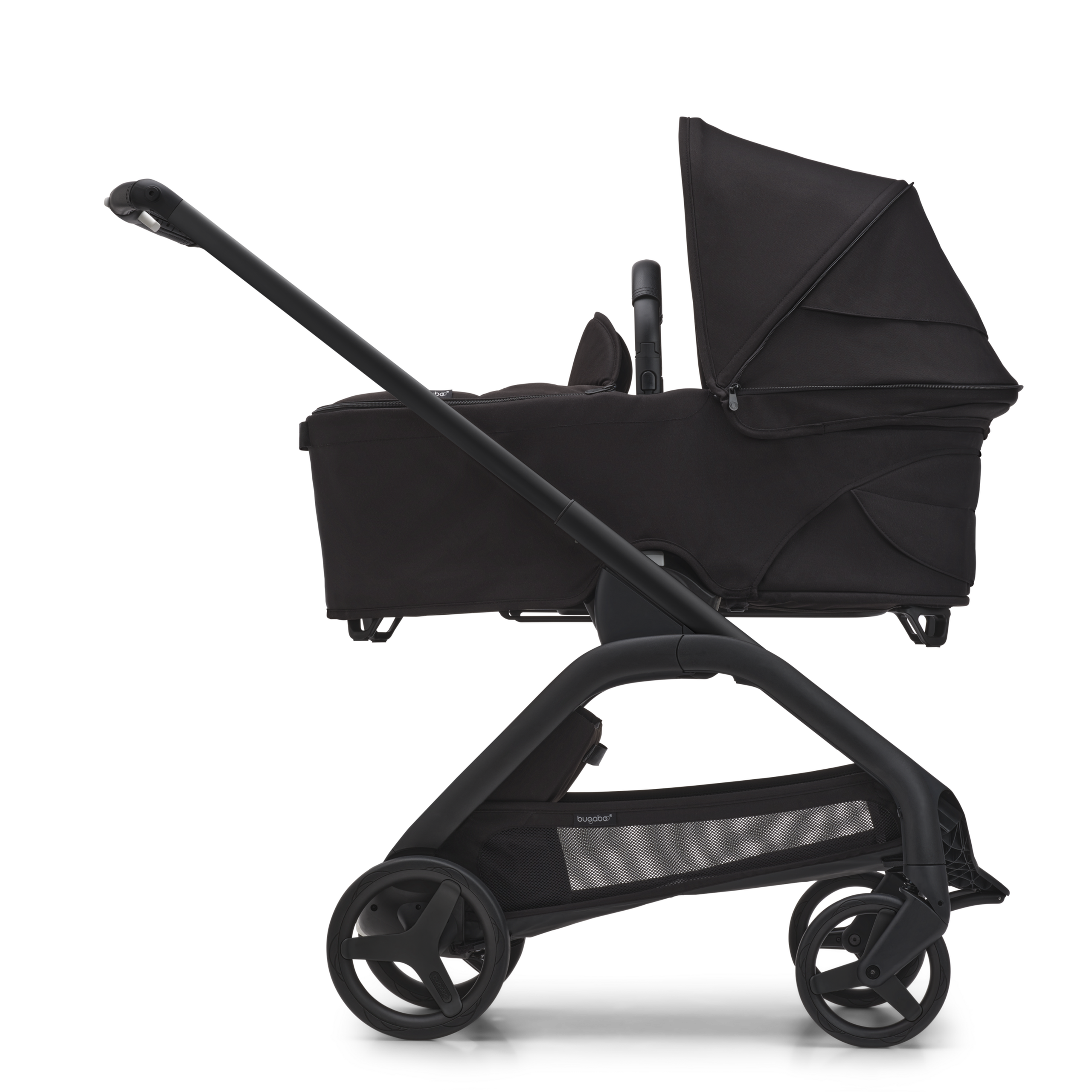 Side view of the Bugaboo Dragonfly bassinet pram with black chassis, midnight black fabrics and midnight black sun canopy. - Thumbnail Slide 3 of 15