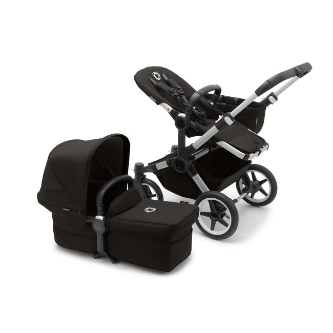 Bugaboo Donkey 5 Mono seat stroller with aluminium chassis and midnight black fabrics, plus bassinet with midnight black sun canopy.