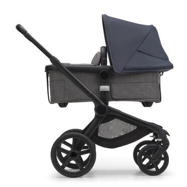 Side view of the Bugaboo Fox 5 carrycot pushchair with black chassis, grey melange fabrics and stormy blue sun canopy. - view 2