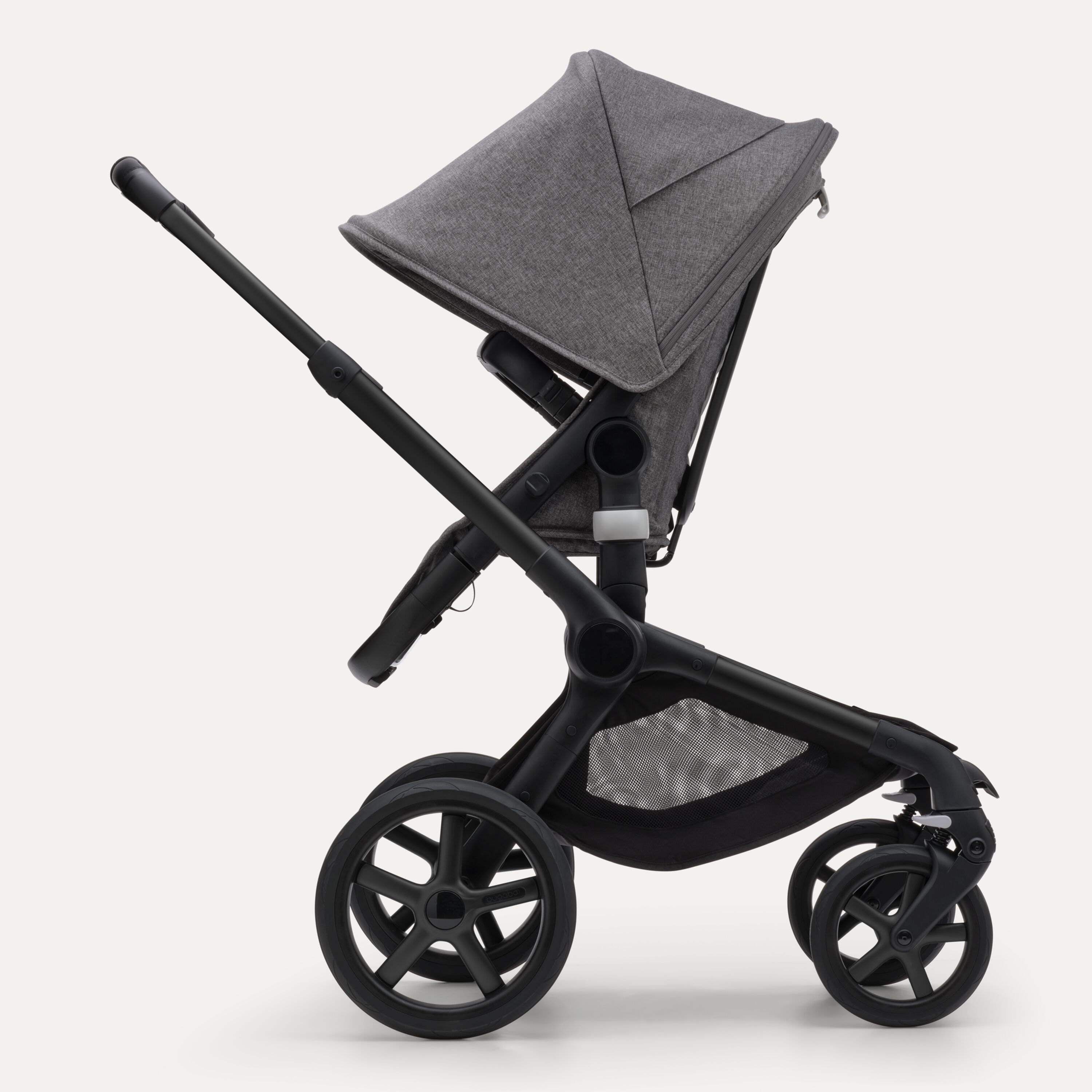 Side view of the Bugaboo Fox 5 seat stroller with black chassis, grey melange fabrics and grey melange sun canopy. - Main Modal Image Slide 3 of 13