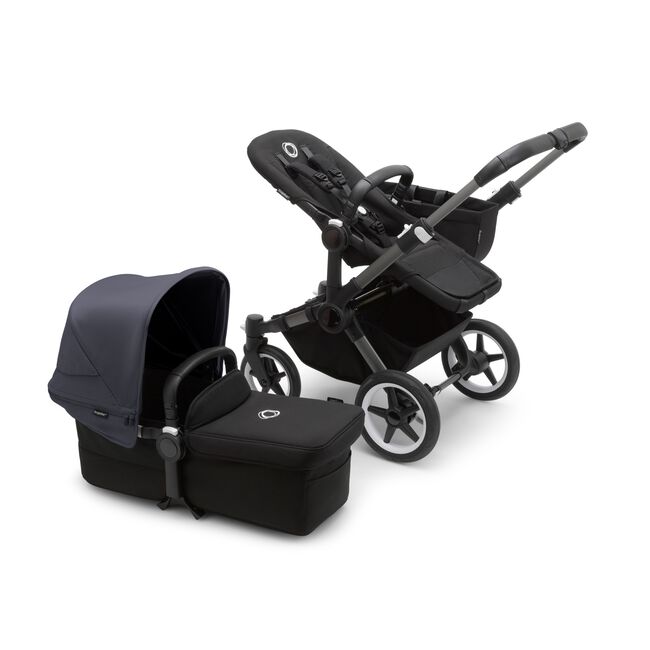 Bugaboo Donkey 5 Mono seat stroller with graphite chassis and midnight black fabrics, plus bassinet with stormy blue sun canopy.
