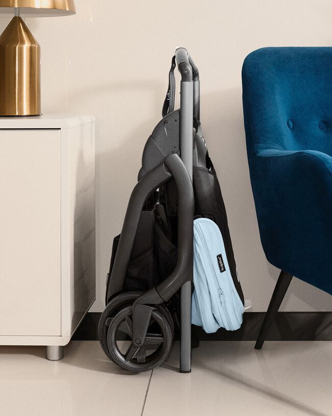 Bugaboo Dragonfly pushchair's compact fold fitting in a small corner of the house.