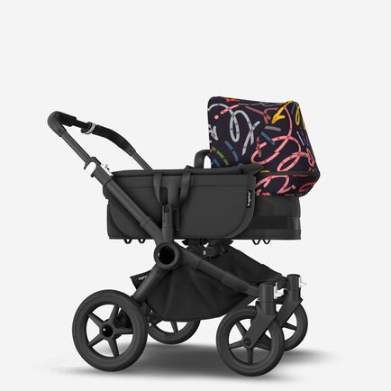 Bugaboo Donkey 5 Mono bassinet and seat stroller black base, midnight black fabrics, art of discovery dark blue sun canopy