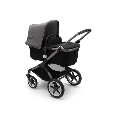 Bugaboo Fox 3 carrycot pushchair with graphite frame, black fabrics, and grey sun canopy.