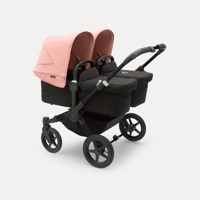 Bugaboo Donkey 5 twin stroller black base, midnight black fabrics, morning pink sun canopy - Main Image Slide 1 of 10