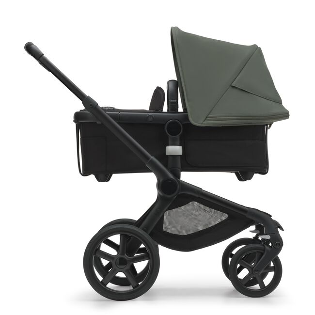 Side view of the Bugaboo Fox 5 bassinet stroller with black chassis, midnight black fabrics and forest green sun canopy. - Main Image Slide 2 of 15