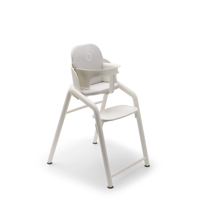 Bugaboo Giraffe chair with baby set and baby pillow set in white.