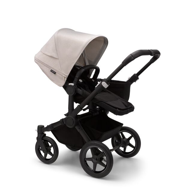 Bugaboo Donkey 5 Mono seat stroller with black chassis, midnight black fabrics and misty white sun canopy.
