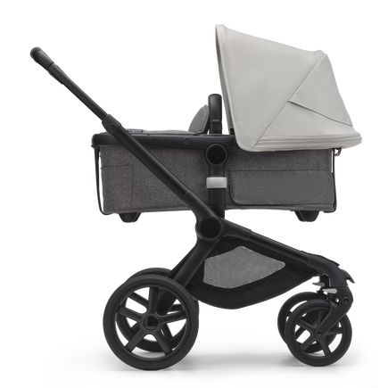 Side view of the Bugaboo Fox 5 bassinet stroller with black chassis, grey melange fabrics and misty white sun canopy. - view 2