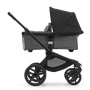 Side view of the Bugaboo Fox 5 bassinet pram with black chassis, forest green fabrics and forest green sun canopy. - Thumbnail Slide 3 of 13