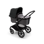 Bugaboo Fox 3 carrycot pushchair with black frame, grey fabrics, and black sun canopy. - Thumbnail Slide 2 of 7
