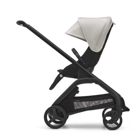 Side view of the Bugaboo Dragonfly seat stroller with black chassis, midnight black fabrics and misty white sun canopy. - view 2