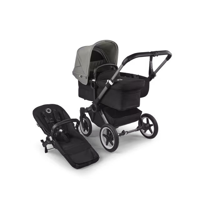 Refurbished Bugaboo Donkey 5 Mono bassinet and seat stroller graphite base, midnight black fabrics, forest green sun canopy - Main Image Slide 1 of 10