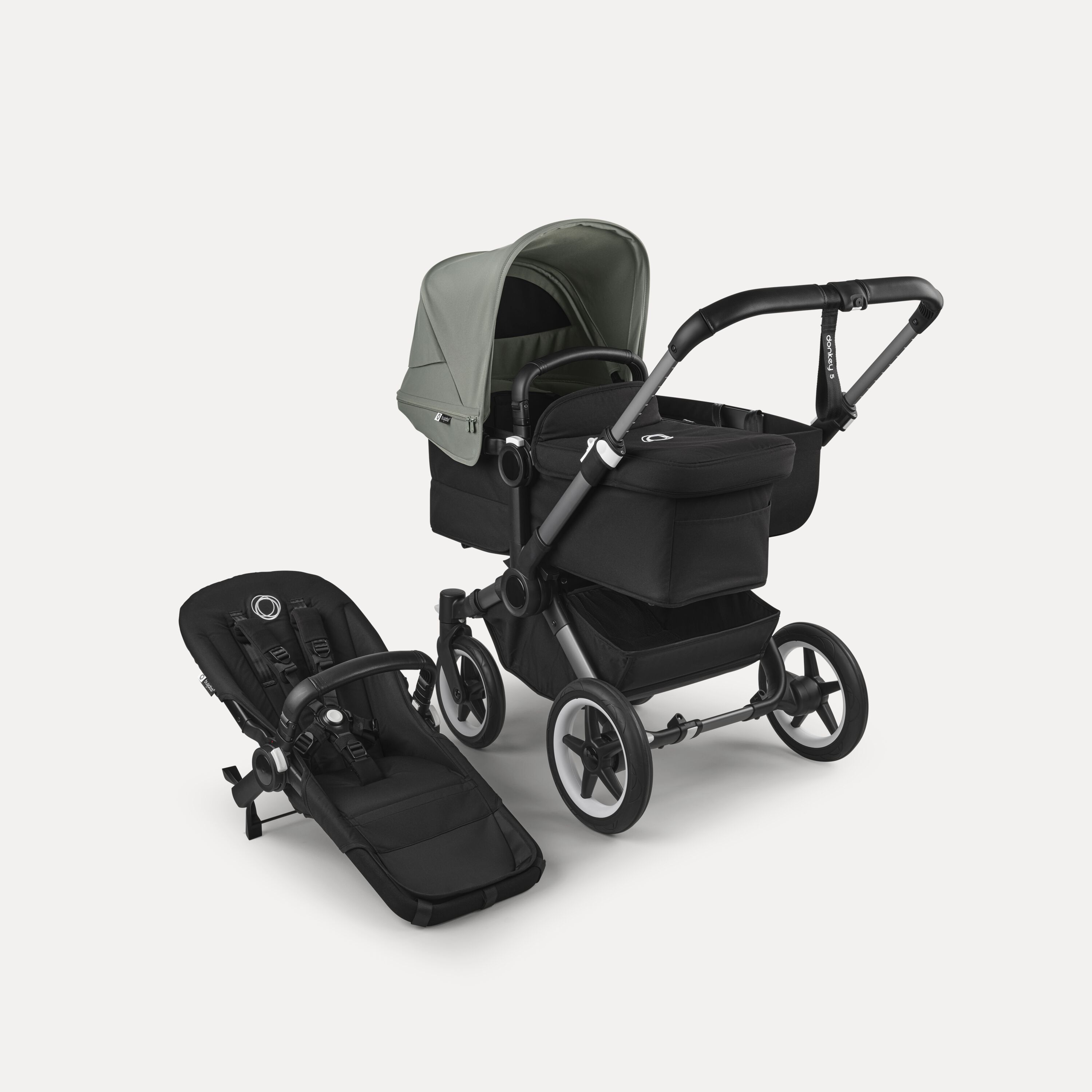 Refurbished Bugaboo Donkey 5 Mono bassinet and seat stroller graphite base, midnight black fabrics, forest green sun canopy - Main Modal Image Slide 1 of 4