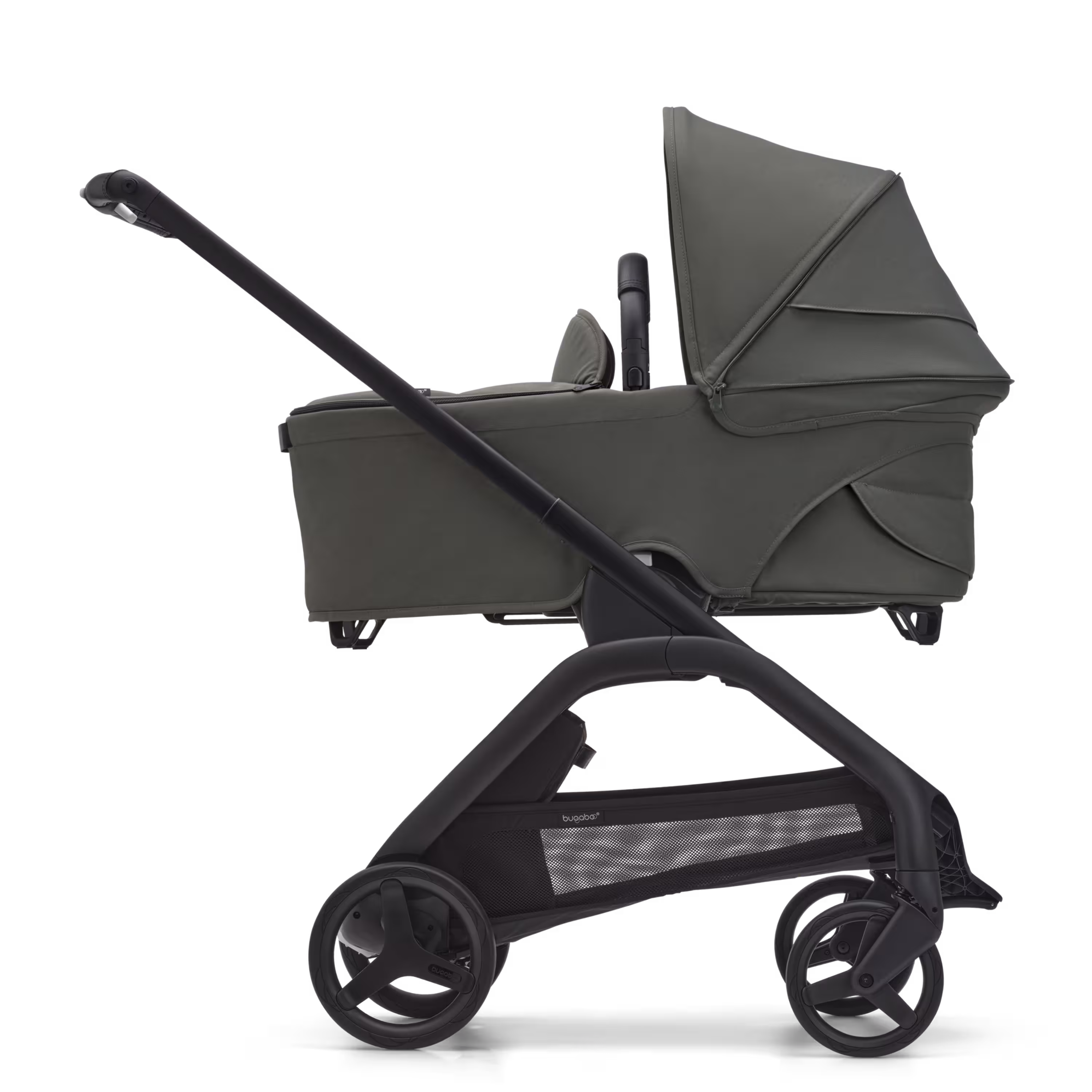 Side view of the Bugaboo Dragonfly bassinet stroller with black chassis, forest green fabrics and forest green sun canopy. - Main Modal Image Slide 3 of 16
