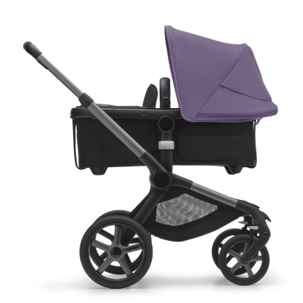 Side view of the Bugaboo Fox 5 bassinet stroller with graphite chassis, midnight black fabrics and astro purple sun canopy. - view 2