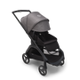 Bugaboo Dragonfly seat stroller with black chassis, midnight black fabrics and grey melange sun canopy. The sun canopy is fully extended.