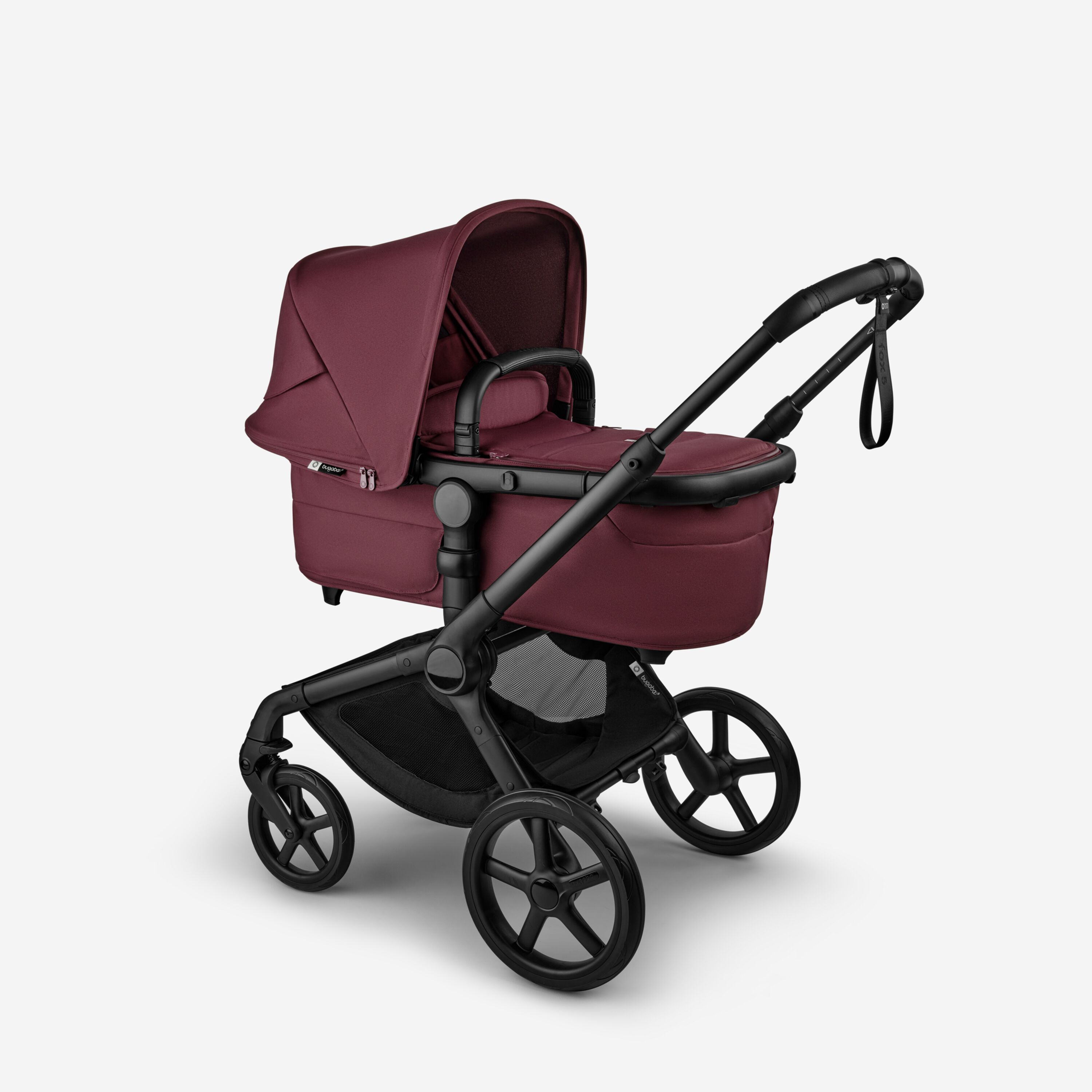 Bugaboo Fox 5 Renew bassinet newborn stroller, with black chassis, Dark Cherry fabrics, and Dark Cherry sun canopy. - Main Modal Image Slide 2 of 12