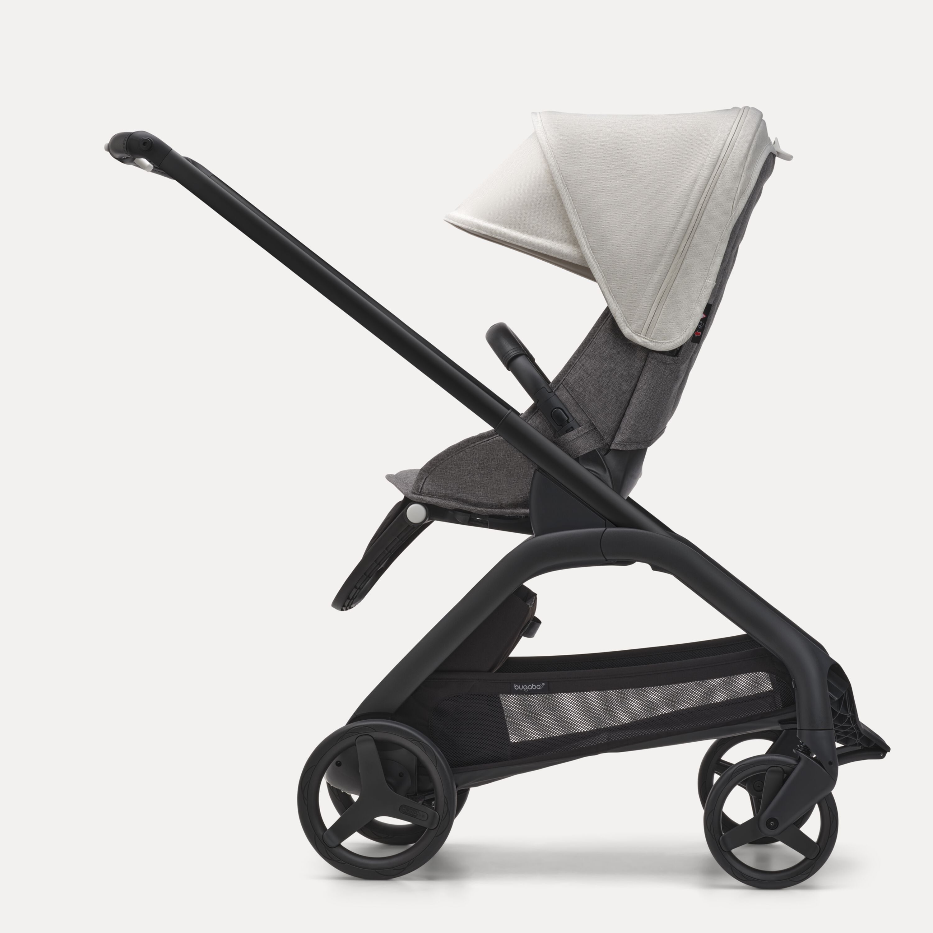 Side view of the Bugaboo Dragonfly seat stroller with black chassis, grey melange fabrics and misty white sun canopy. - Main Modal Image Slide 2 of 16