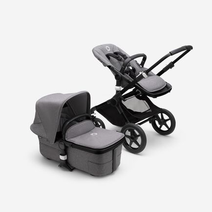 Bugaboo Fox 3 bassinet and seat stroller with black frame, grey fabrics, and grey sun canopy.