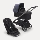 Carrito con silla y capazo Bugaboo Dragonfly con chasis grafito, fundas negro medianoche y capota azul tormenta.
